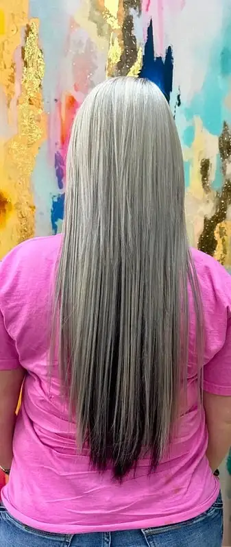 Long, flowing hair extensions blended seamlessly.